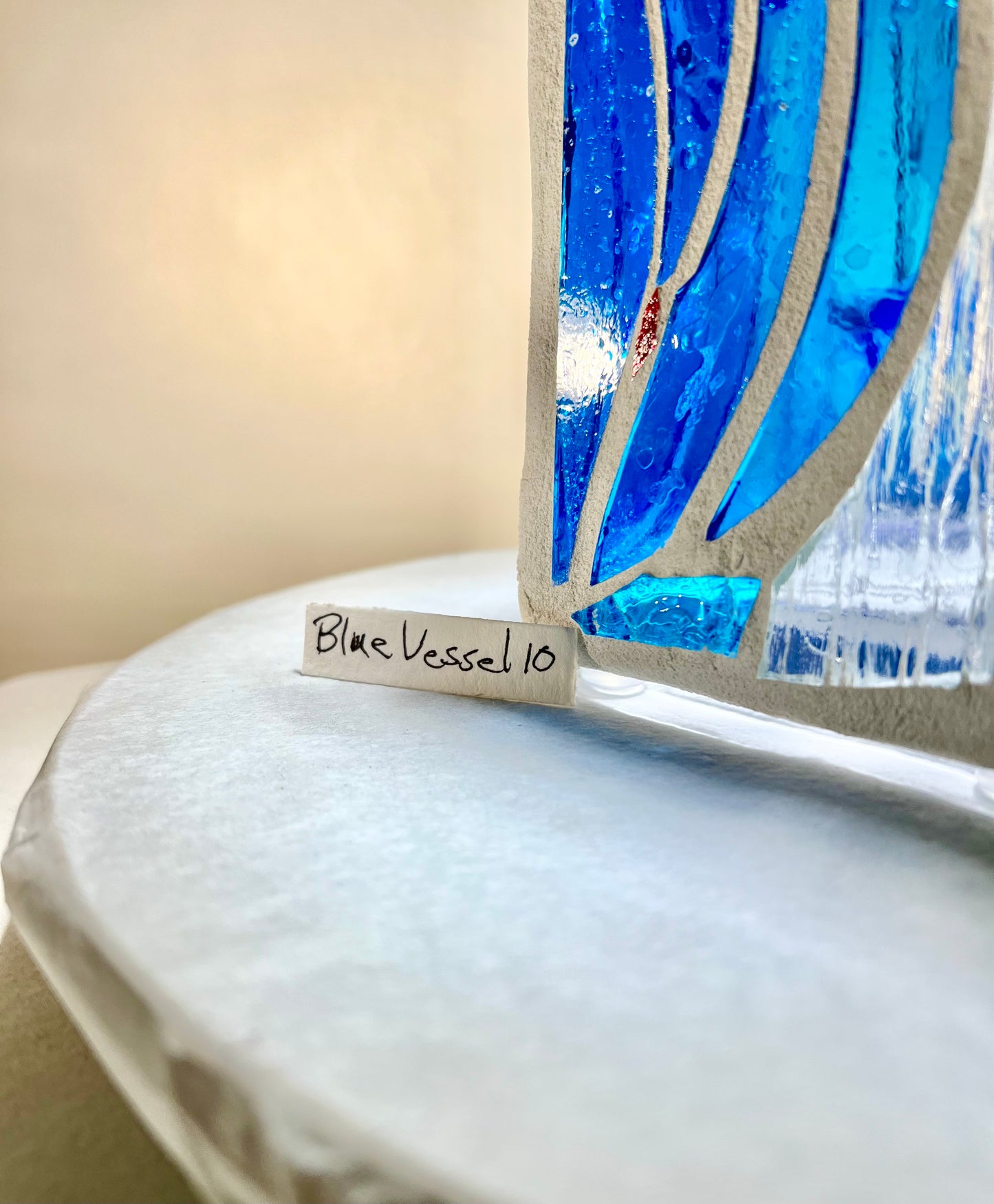 "Blue Vessel" Stained glass candleholder , blue, a little red, and crystal clear glass, bright white grout