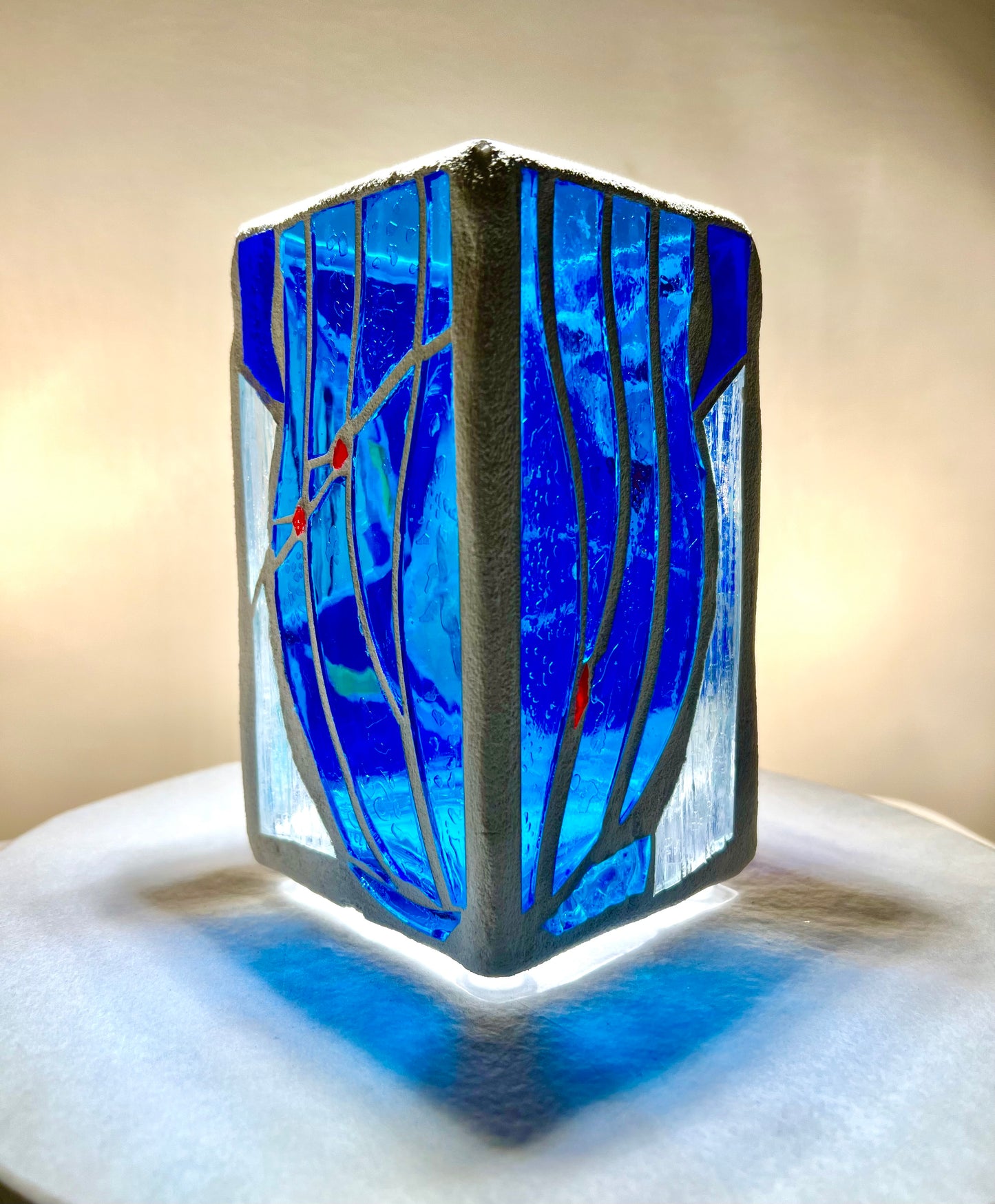 "Blue Vessel" Stained glass candleholder , blue, a little red, and crystal clear glass, bright white grout