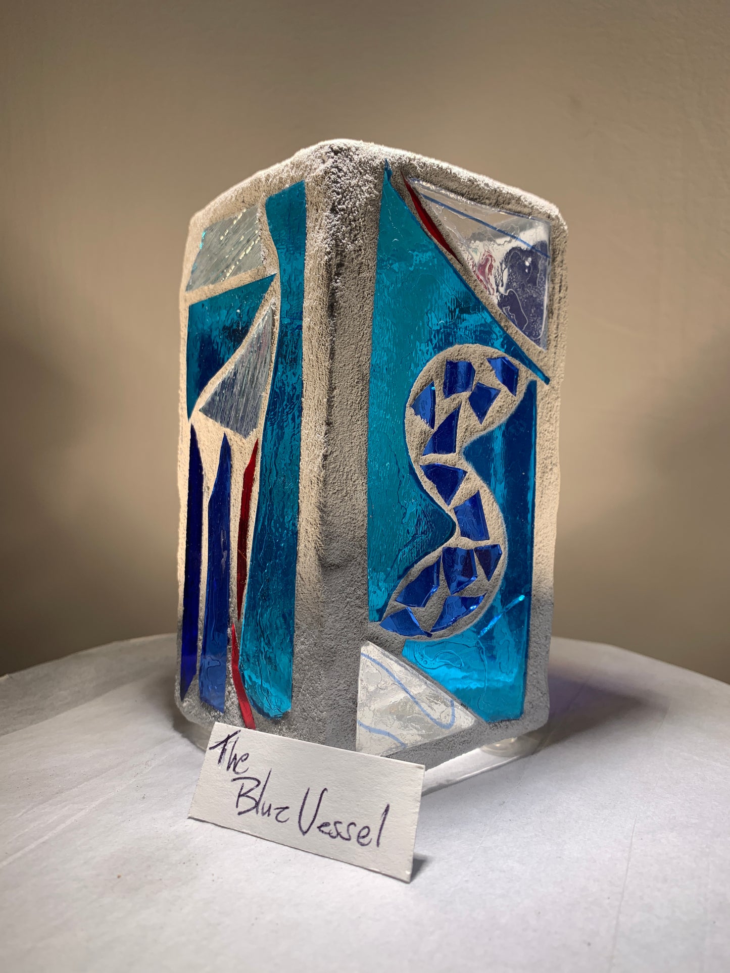 "Blue Vessel" Stained glass candleholder , blue, a little red, and crystal clear glass, bright white grout