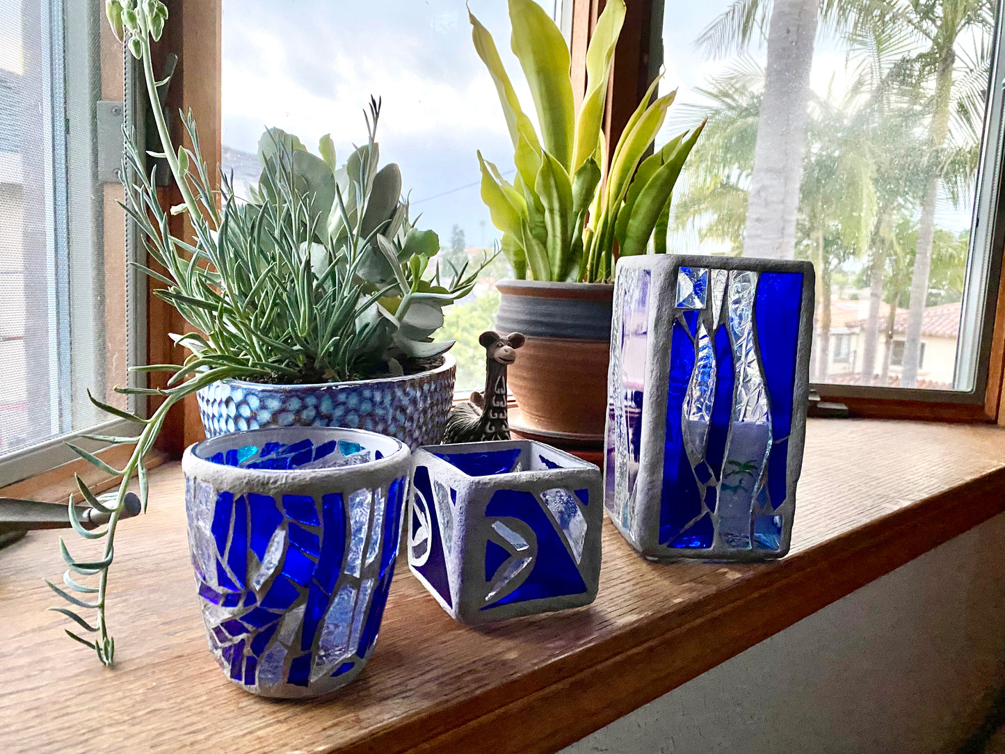 "Blue Crystal"  Stained Glass Candle Holder – Blue and Clear Glass with Delorean Gray Grout | Cathedral Candles"